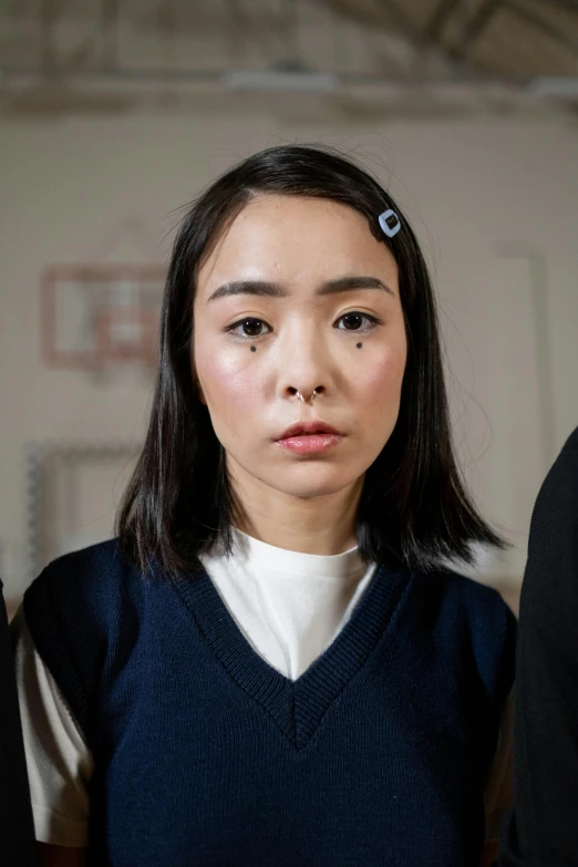 a group of people standing next to each other, inspired by Zhang Xiaogang, trending on pexels, shin hanga, young woman's face, scowling, school girl, yoshitomo nara