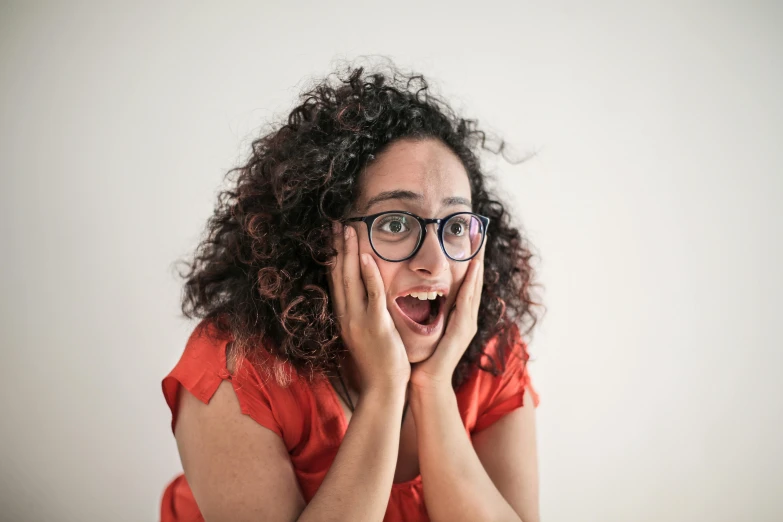 a woman with a surprised look on her face, pexels, ashteroth, people screaming, avatar image, spectacled