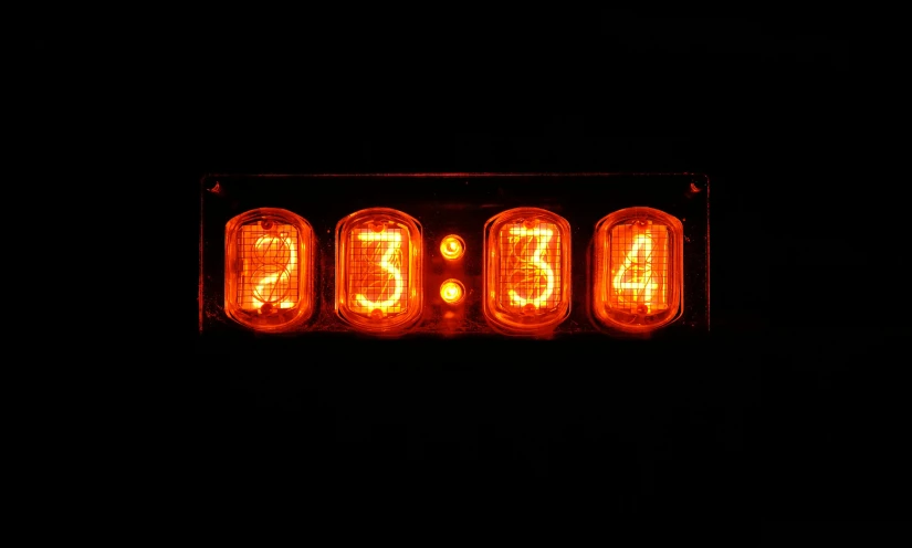 a clock is lit up in the dark, by Jan Rustem, nuclear art, orange neon, four, adafruit, album