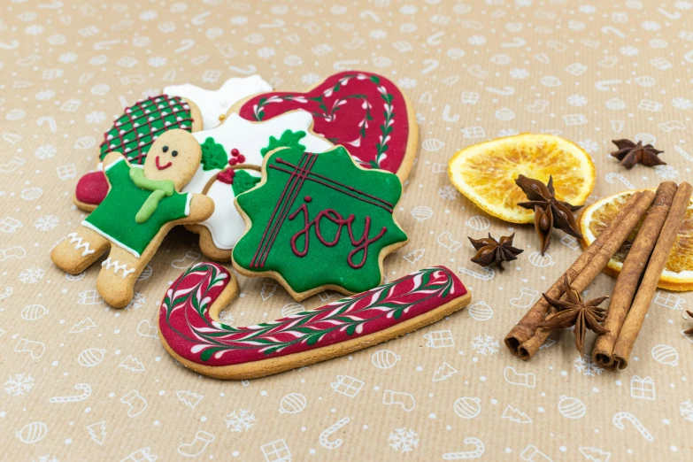 a couple of cookies sitting on top of a table, by Emma Andijewska, pexels, folk art, red and green, candy canes, ilustration, detailed product shot