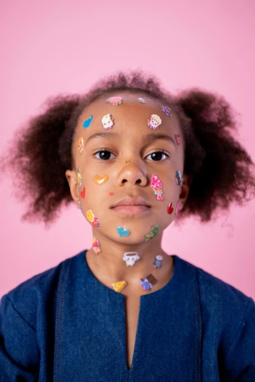 a little girl with paint all over her face, an album cover, inspired by Hikari Shimoda, trending on pexels, toyism, mixed-race woman, puffy sticker, covered in circuitry, aida muluneh