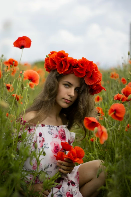 a woman sitting in a field of red flowers, a portrait, by Adam Marczyński, pexels contest winner, teenager girl, orange halo around her head, russian girlfriend, slide show