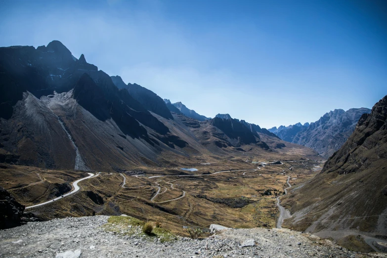 a view of the mountains from the top of a mountain, by Breyten Breytenbach, pexels contest winner, les nabis, neo - andean architecture, paved roads, avatar image, panoramic