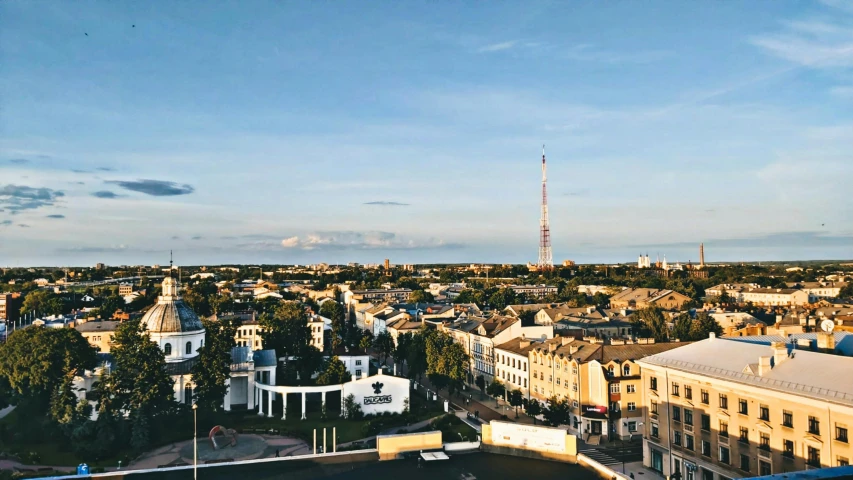 a view of a city from the top of a building, by Julia Pishtar, capital of estonia, profile image, jerez, summer evening