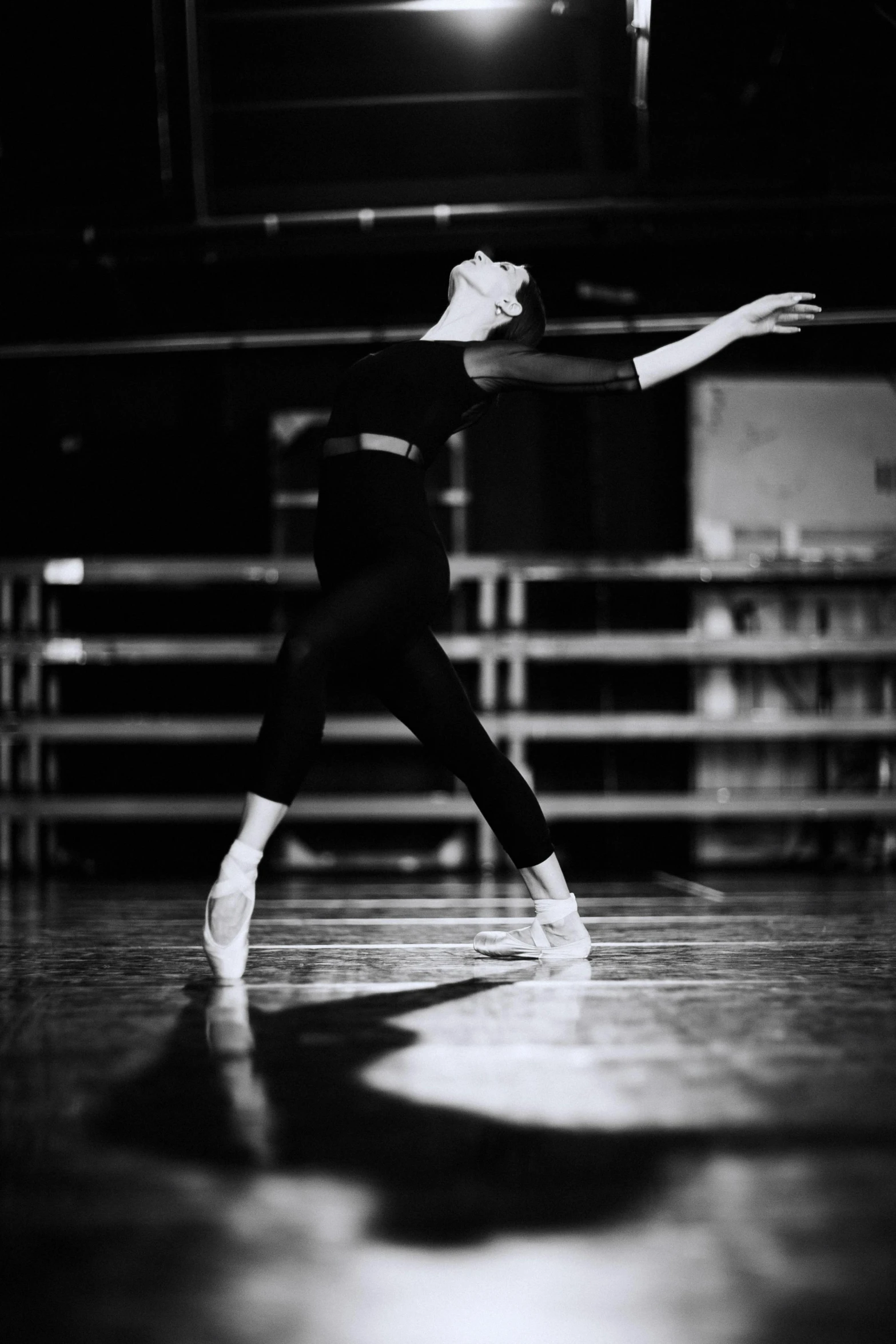 a black and white photo of a woman in a dance pose, by Elizabeth Polunin, unsplash, arabesque, taken in the late 1980s, guard, instagram picture, sports