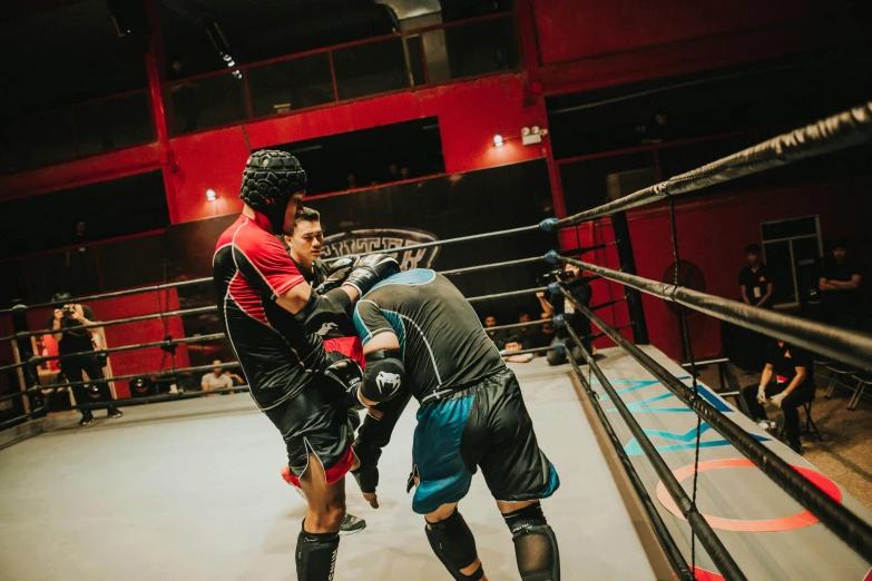 a couple of men standing next to each other in a boxing ring, unsplash, happening, black and red scheme, manuka, action with run and fight, inside a grand