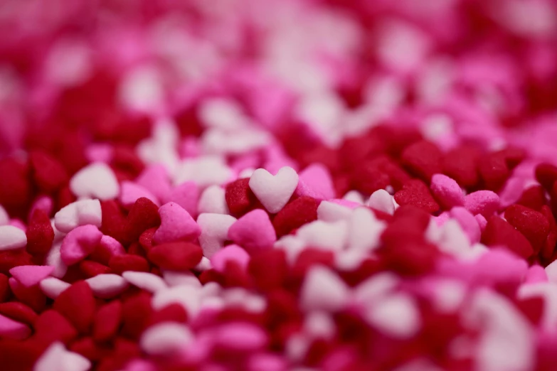 a pile of red and white sprinkles, pexels, visual art, pink hearts in the background, magenta, aaron fallon, 1024x1024