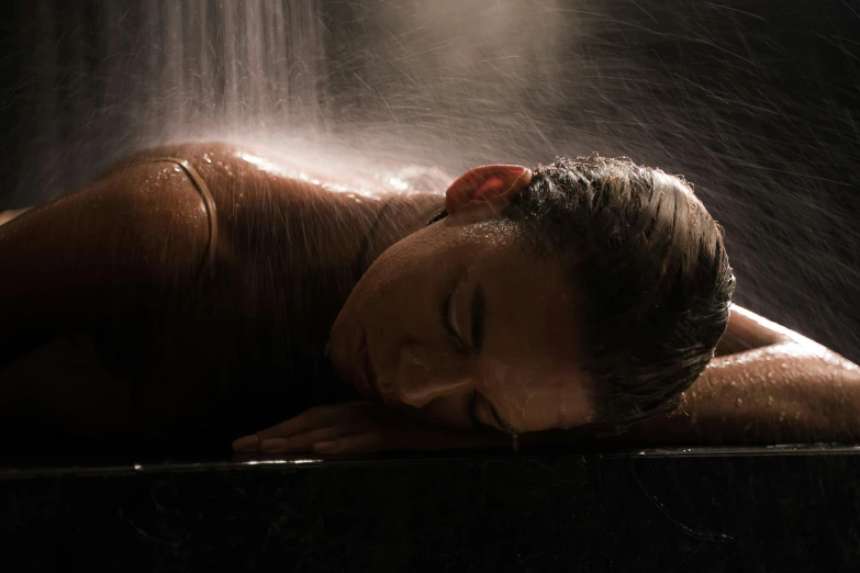 a woman that is laying down under a shower, anomalisa, spa, thumbnail, profile image