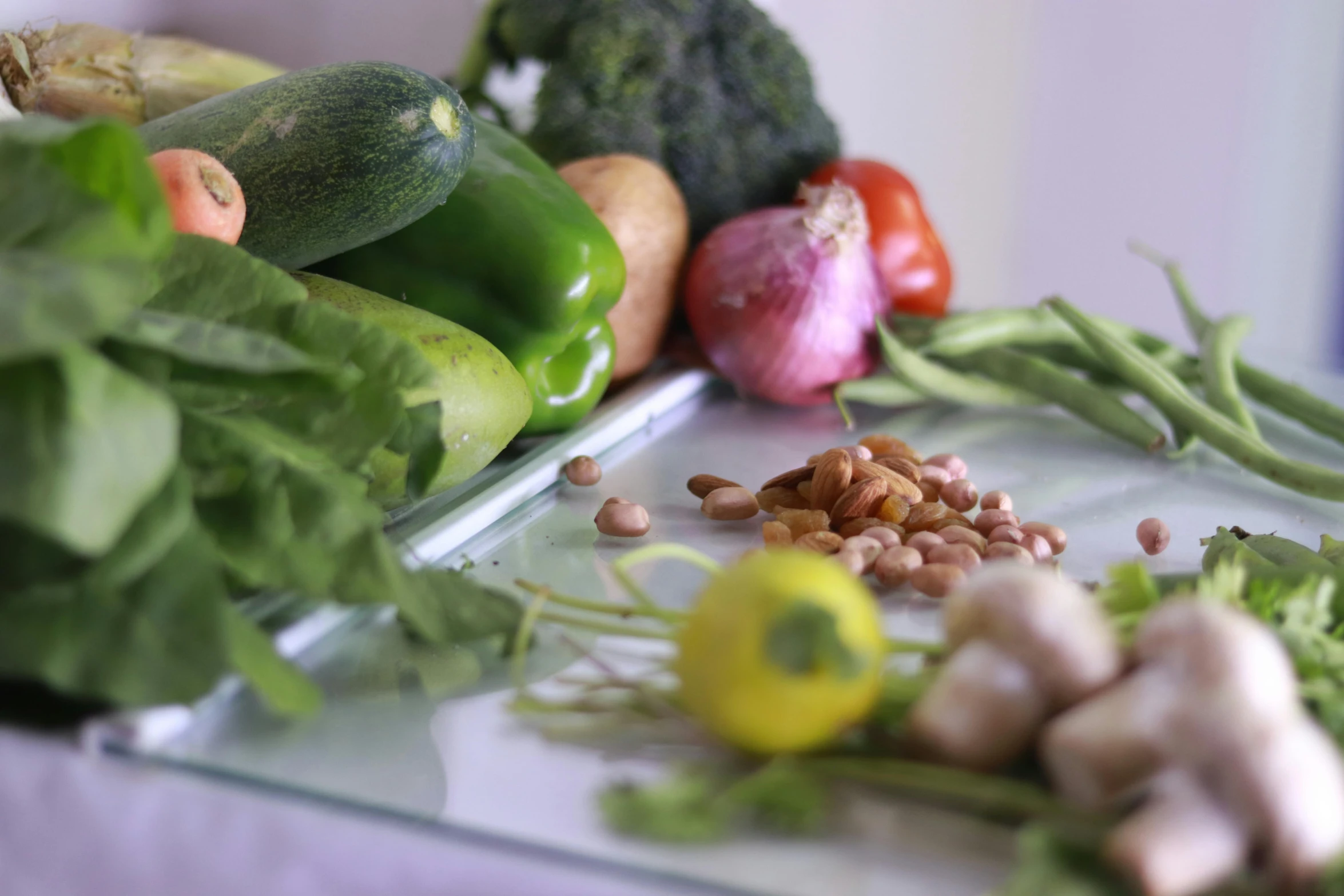 a table topped with lots of different types of vegetables, a still life, by Julian Allen, pexels, a green, close up half body shot, clear focused details, product introduction photo