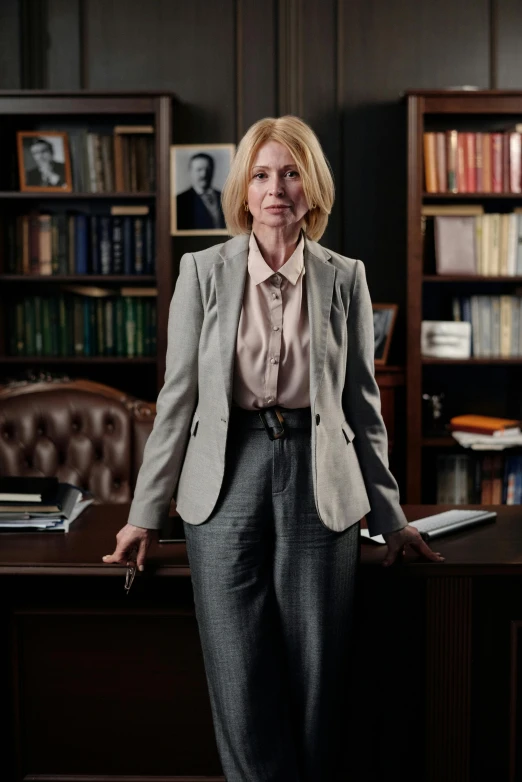 a woman standing in front of a desk in an office, by Harriet Zeitlin, photorealism, wearing a worn out suit, president of belorussia, natgeo, official product photo