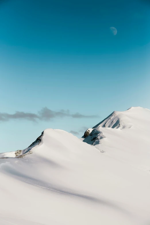 a man riding a snowboard down the side of a snow covered slope, by Daniel Seghers, trending on unsplash, minimalism, an icelandic landscape, white and pale blue, an ice volcano, 1 2 9 7