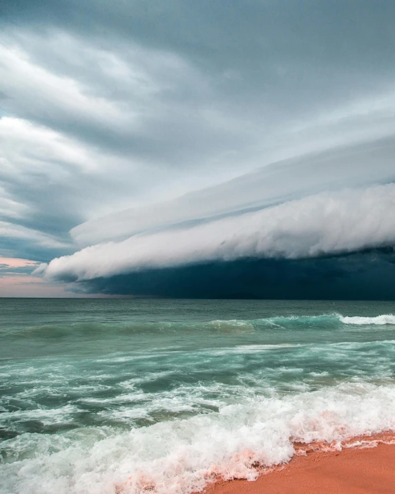 a large cloud over the ocean on a cloudy day, unsplash contest winner, surrealism, on a hot australian day, lgbtq, hailstorm, taken in the late 2010s