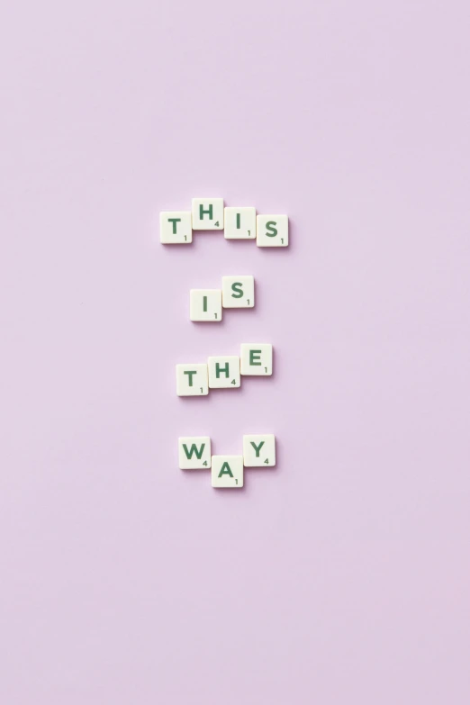 scrabbles spelling this is the way on a pink background, an album cover, aestheticism, white and purple, unsplash contest winning photo, wallpaper aesthetic, ffffound