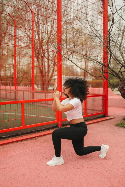 a woman standing on a tennis court holding a tennis racquet, pexels contest winner, arabesque, lifting weights, afro, parkour, ad image