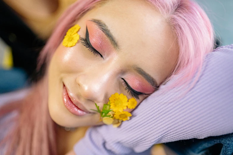 a woman with pink hair and yellow flowers on her face, trending on pexels, aestheticism, sleeping beauty, relaxed eyebrows, pokimane, resting head on hands