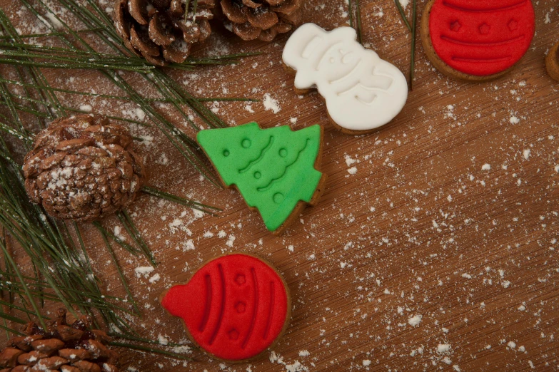 a close up of some cookies on a table, inspired by Ernest William Christmas, unsplash, folk art, red green, fir trees, high quality product image”, carved soap