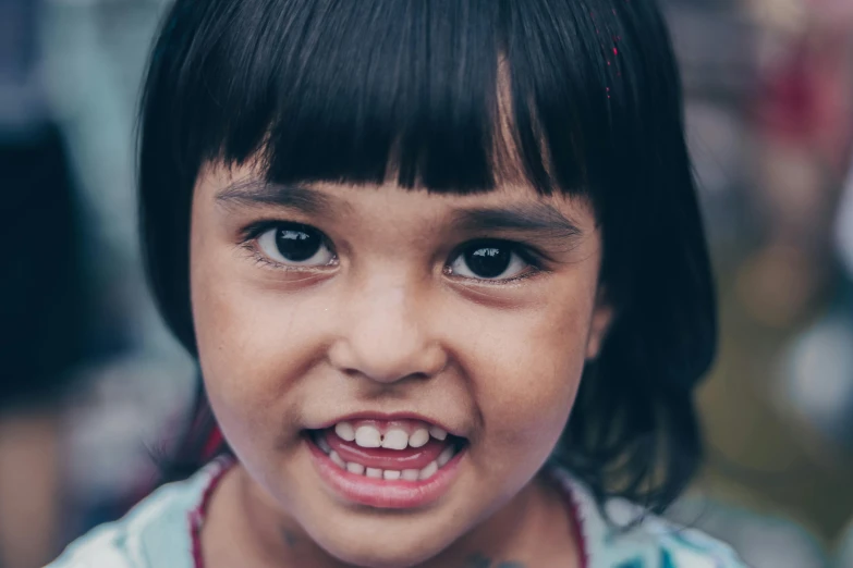 a little girl with a big smile on her face, pexels contest winner, hurufiyya, close up character, severe expression, smaller mouth, beautiful highly symmetric face