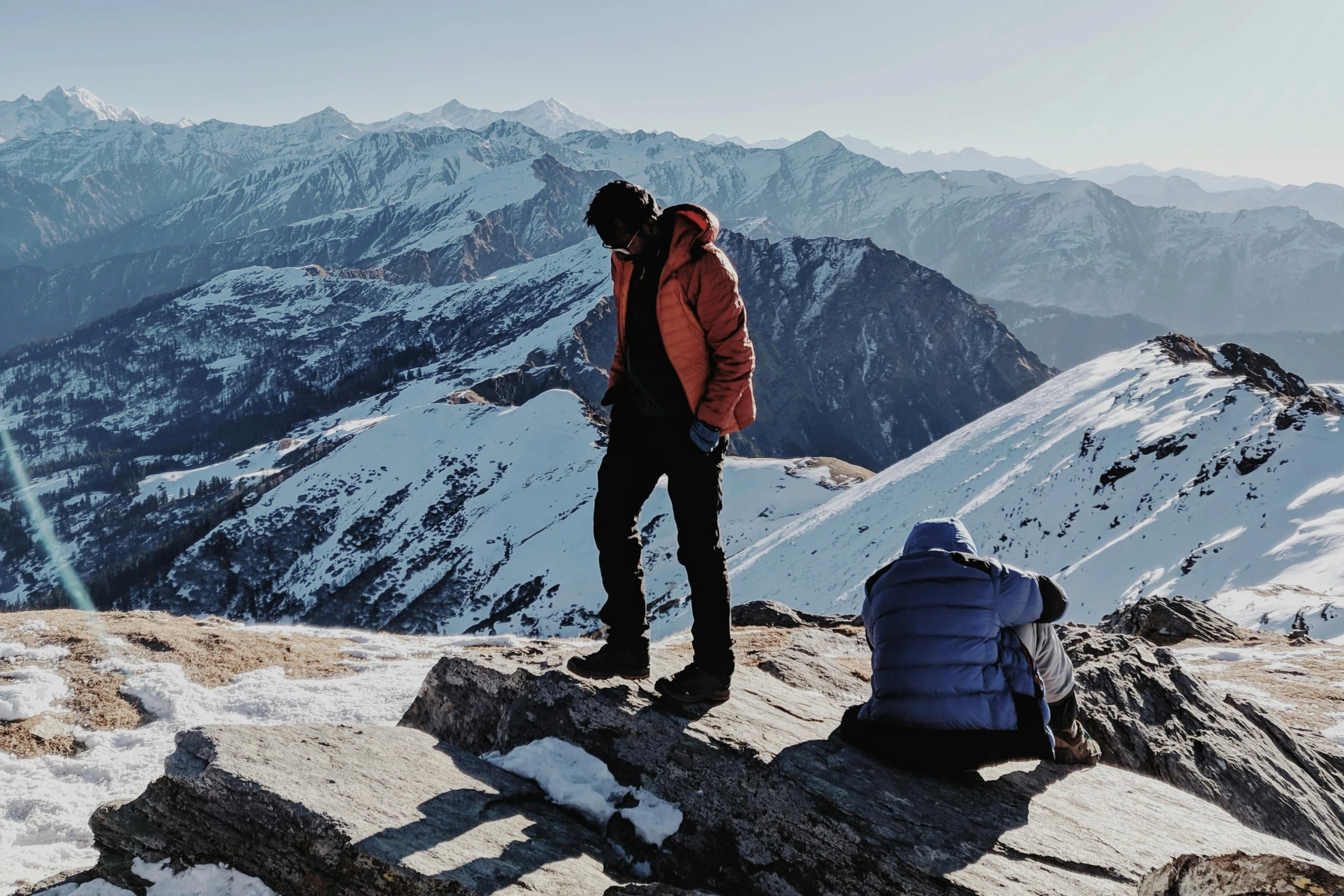 a man standing on top of a snow covered mountain, flatlay, ash thorp khyzyl saleem, profile image, towering above a small person