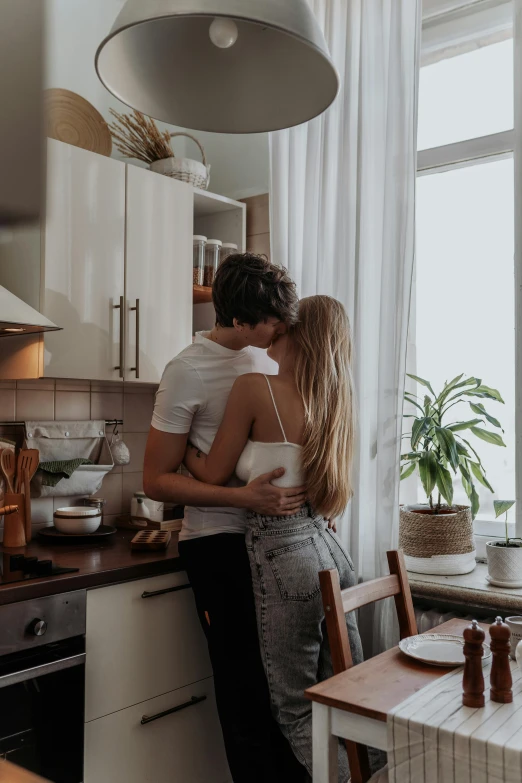 a man and a woman standing in a kitchen, pexels contest winner, romanticism, lovely kiss, romantic greenery, 🚿🗝📝, with his back turned