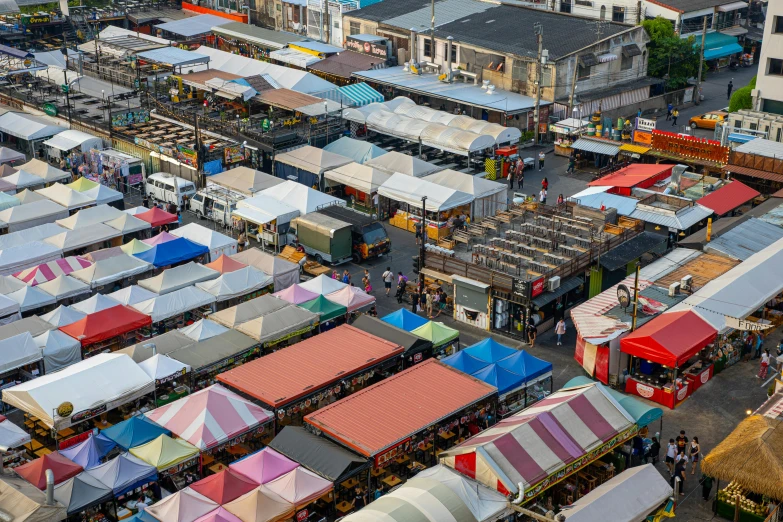 a market filled with lots of colorful tents, birdseye view, fan favorite, square, gray