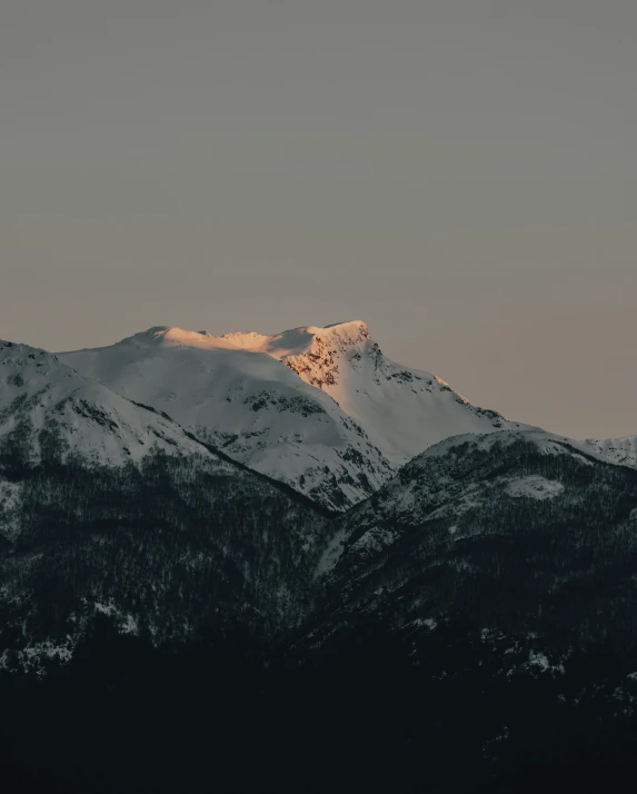 the sun shines on the top of a mountain, unsplash contest winner, romanticism, whistler, grey, (golden hour), single light