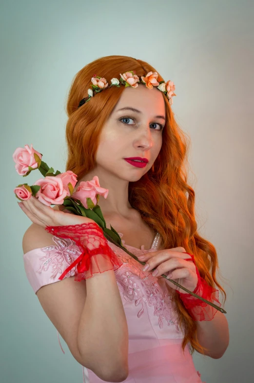 a woman in a pink dress holding a bunch of flowers, inspired by Magali Villeneuve, pixabay contest winner, a redheaded young woman, cosplay photo, crown of mechanical peach roses, red headband