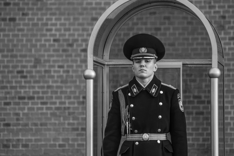 a black and white photo of a man in uniform, by Emma Andijewska, pixabay, private press, russian national guard, police station, military girl, recital