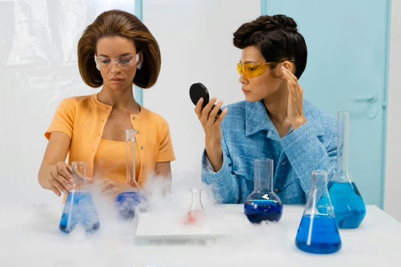 a couple of women sitting next to each other at a table, trending on pexels, futuristic chemistry lab, looking into a mirror, powder, 🚀🌈🤩