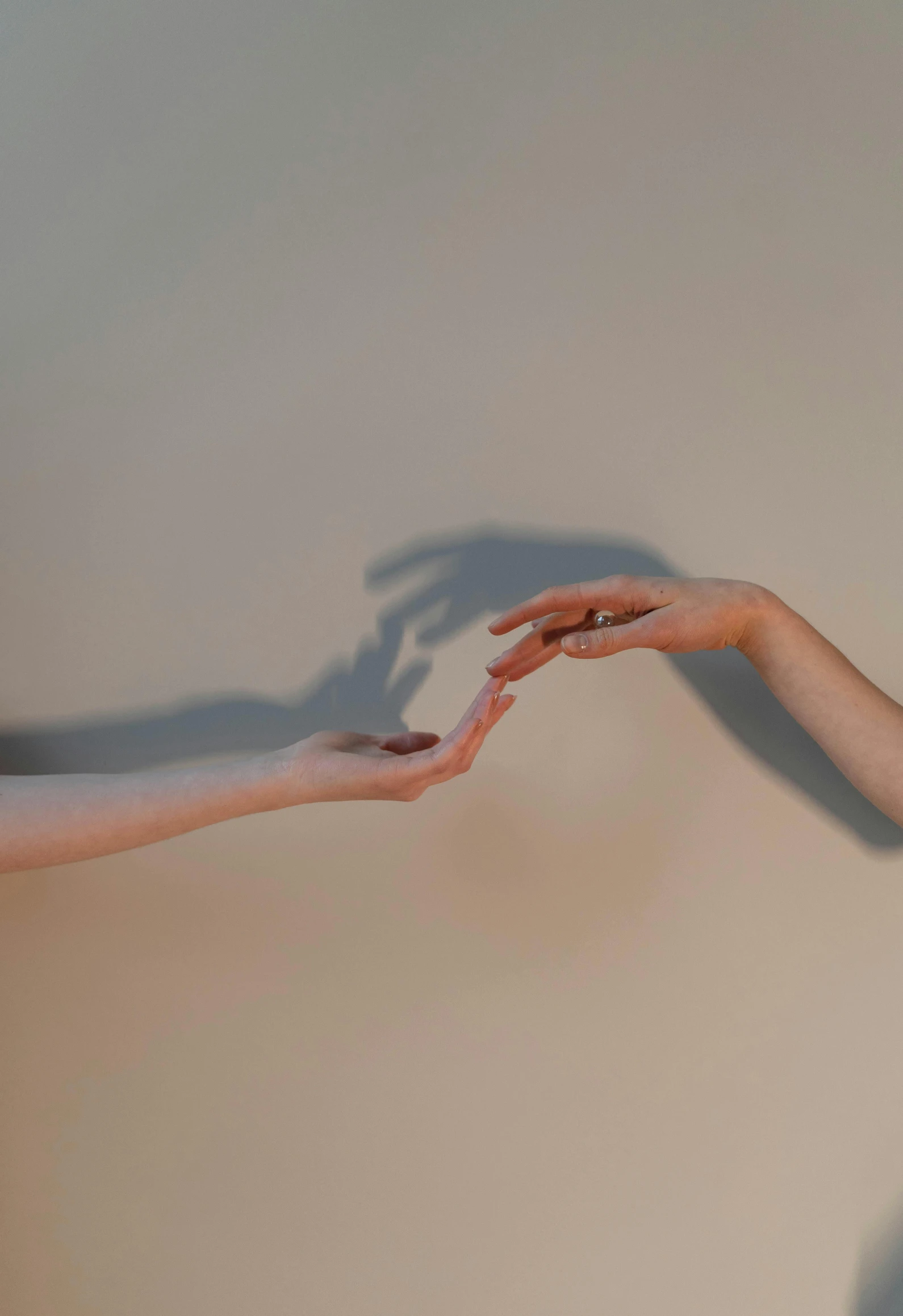 a woman reaching out to another woman's hand, by Emily Shanks, unsplash, conceptual art, soft shadow, 2010s, ignant, mythological