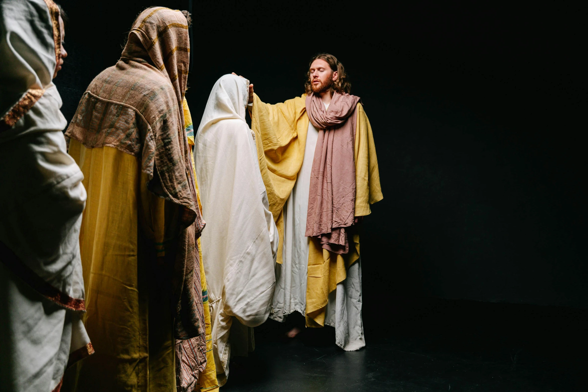 a group of people standing next to each other, unsplash, renaissance, religious robes, performance art, jesus, ( ( theatrical ) )