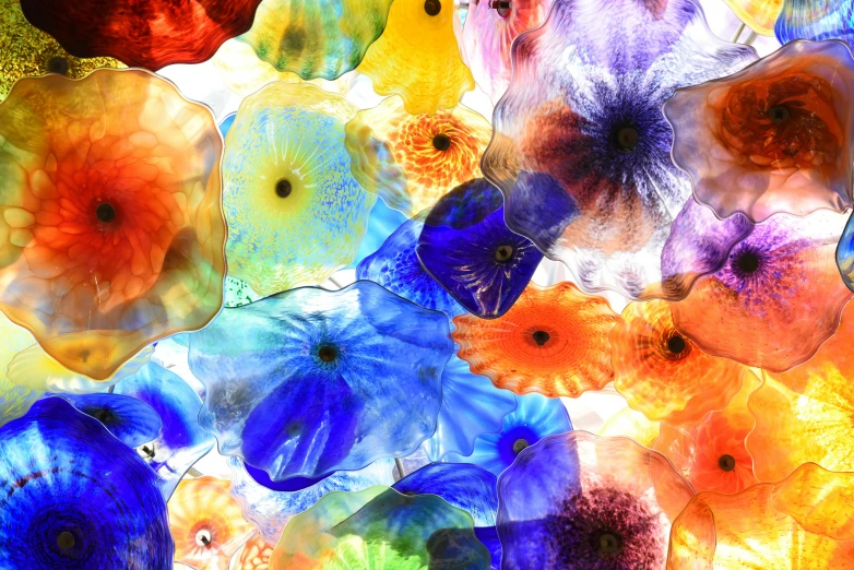a bunch of colorful glass flowers hanging from the ceiling, an album cover, inspired by Louis Comfort Tiffany, pexels, abstract expressionism, neri oxman, large scale photo, desktop wallpaper