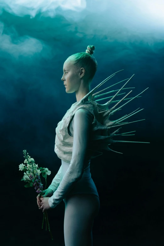 a woman holding a bunch of flowers under a cloudy sky, an album cover, by Anna Füssli, unsplash contest winner, aestheticism, in white futuristic armor, tilda swinton, portrait of mermaid, standing in a dark forest