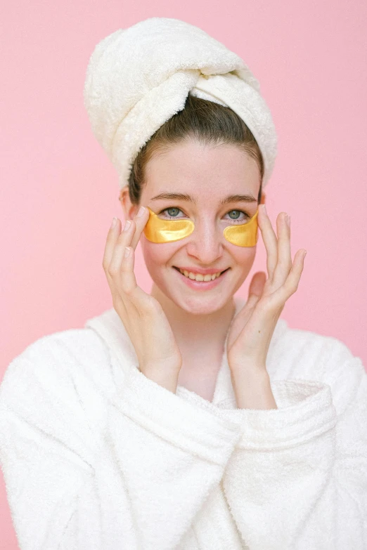 a woman with a towel on her head and orange slices on her eyes, by Julia Pishtar, trending on pexels, renaissance, wearing gold glasses, japanese collection product, pink and gold, skincare