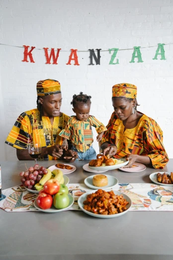 a group of people sitting at a table with plates of food, an album cover, by Ingrida Kadaka, pexels contest winner, portrait of family of three, wearing festive clothing, african, promotional image