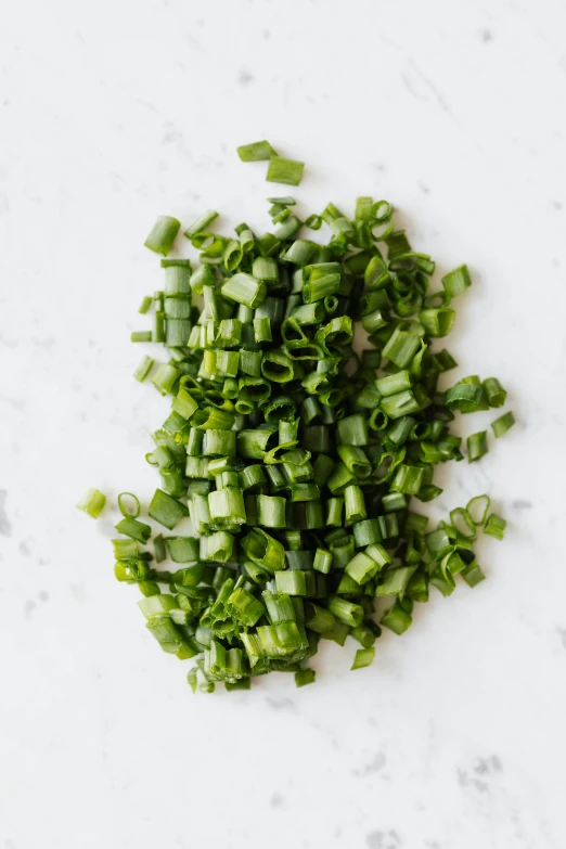 chopped green onions on a white counter top, inspired by Lam Qua, reddit, renaissance, detailed product image, shiny crisp finish, on a gray background, smooth matte