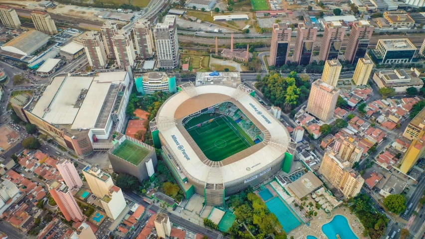 an aerial view of a soccer stadium in a city, by Felipe Seade, pexels contest winner, renaissance, 🐝👗👾, square, turf roof, profile image