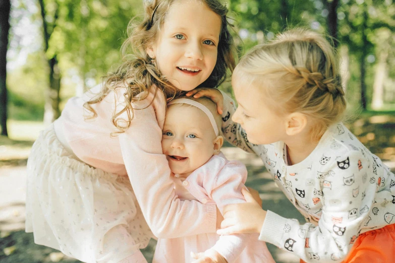 a couple of little girls standing next to each other, pexels contest winner, incoherents, babies in her lap, 15081959 21121991 01012000 4k, three heads, hugging each other