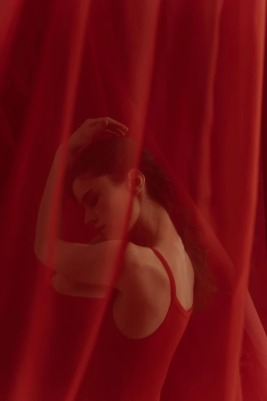 a woman standing in front of a red curtain, selena gomez, showstudio, more intense, dreamy sequence