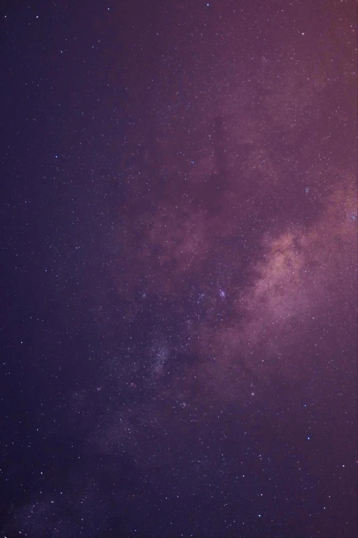 a night sky filled with lots of stars, trending on unsplash, space art, gradient purple, milkyway, muted colours 8 k, maroon mist