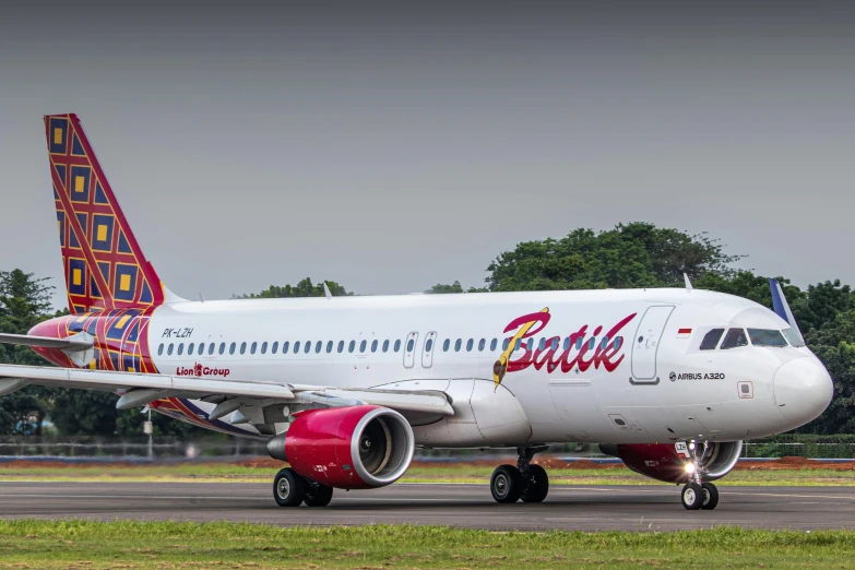 a large jetliner sitting on top of an airport runway, by Daniel Lieske, pexels contest winner, graffiti, pink and red color style, bali, avatar image, battle stance