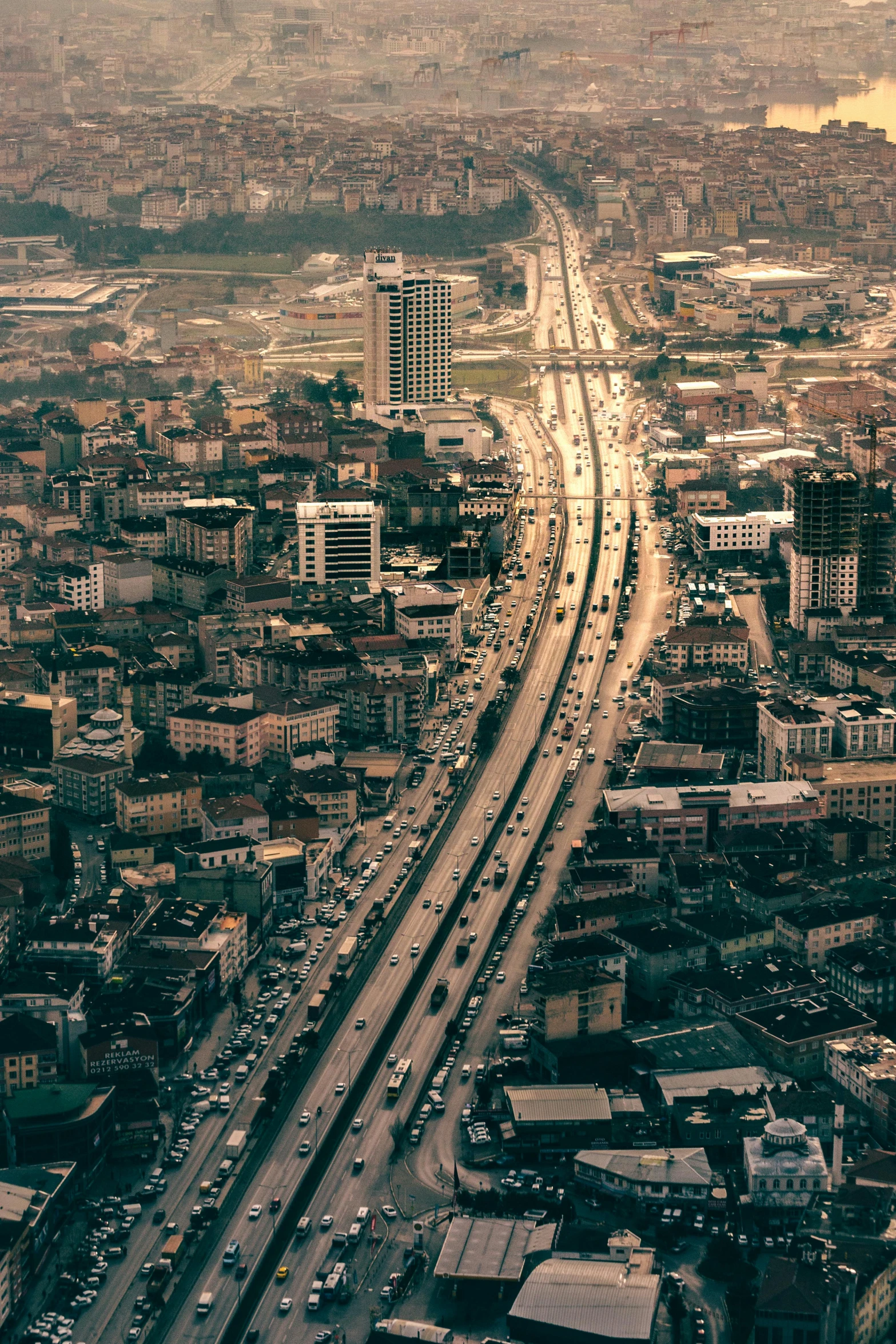 a city filled with lots of traffic next to tall buildings, by Ibrahim Kodra, freeway, aerial, blank, naples