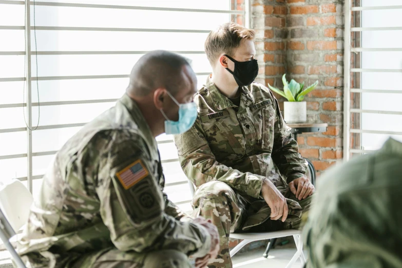 a group of soldiers sitting next to each other, a portrait, pexels, medical mask, avatar image, white american soldier, lgbtq