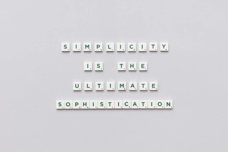 a sign that says simplicity is the ultimate sophiistication, unsplash, minimalism, knolling, made of all white ceramic tiles, taken in the early 2020s, addiction