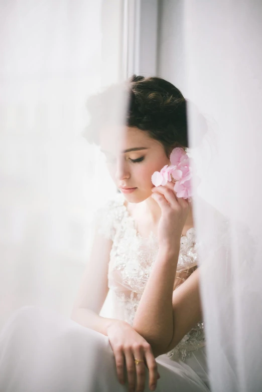 a woman in a wedding dress holding a flower, by Natasha Tan, romanticism, soft window light, pink, boke, item