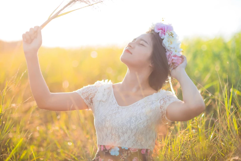 a woman standing in a field with a flower crown on her head, sunny lighting, avatar image, asian women, casual photography