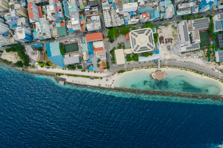 an aerial view of a city next to the ocean, pexels contest winner, hurufiyya, maldives in background, high resolution details, icon, full body image