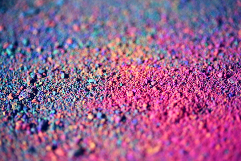 a close up of a rainbow colored surface, a microscopic photo, inspired by Attila Meszlenyi, unsplash, color field, rainbow colored dust mask, dreamy colorful cyberpunk colors, desaturated colours, vibrant scattered light