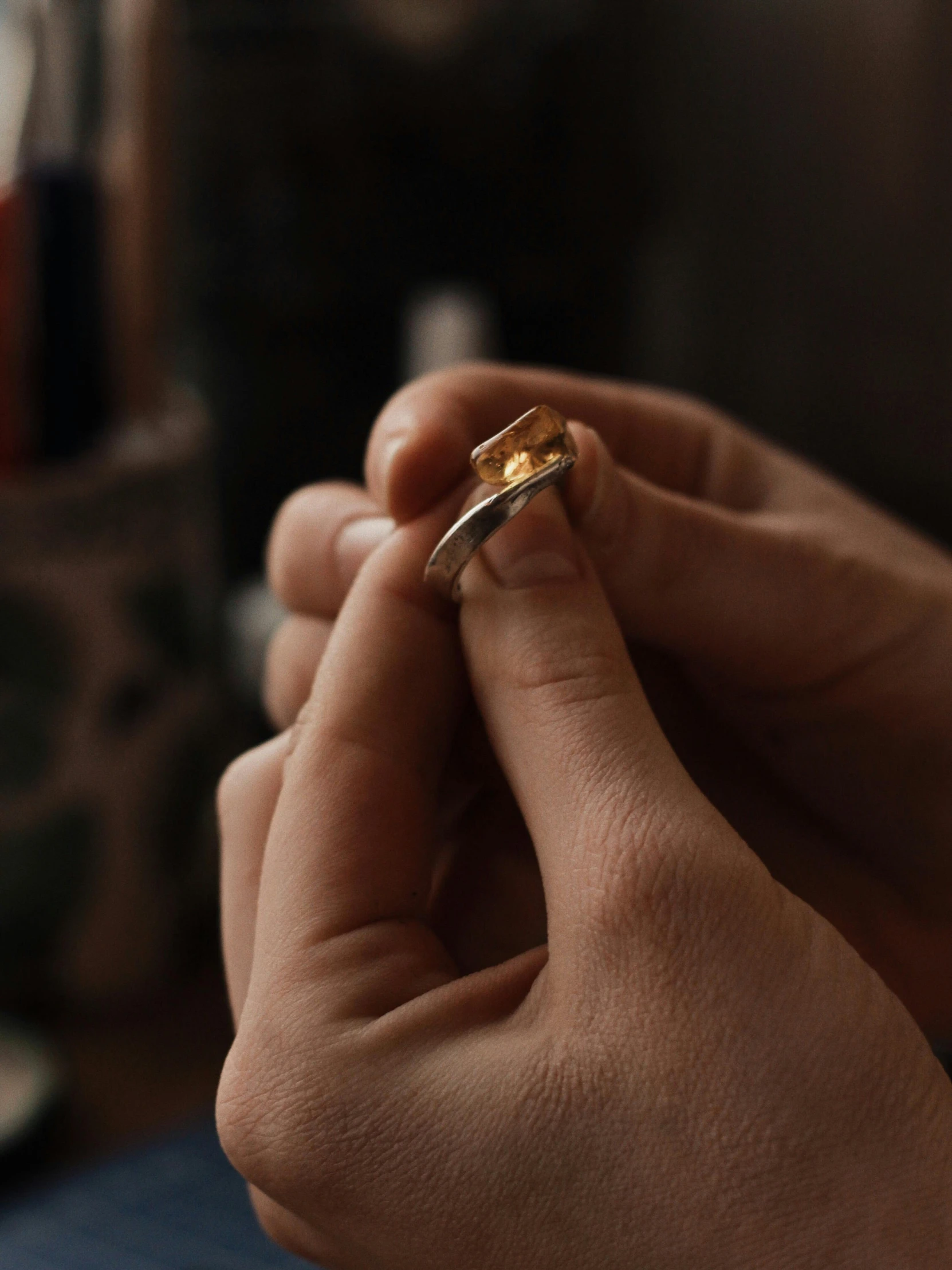 a close up of a person holding a ring, process art, instagram story, wide film still, inlaid with gold, cinematic full shot