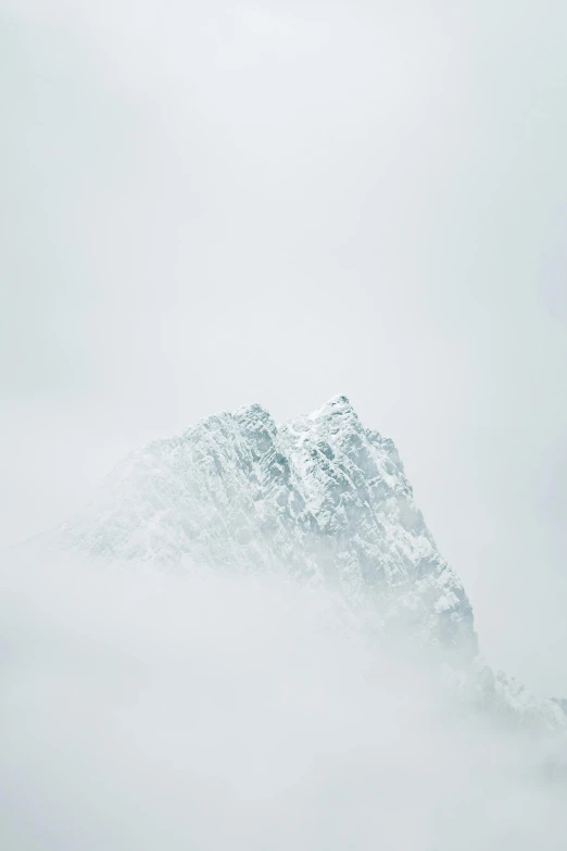 a man riding a snowboard down a snow covered slope, a picture, unsplash contest winner, minimalism, castle made of clouds, moist foggy, iceberg, nordic