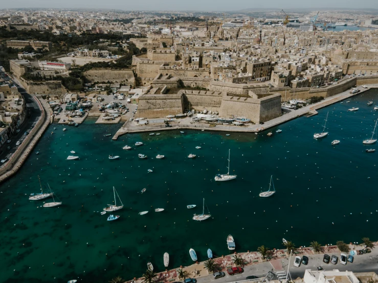a large body of water filled with lots of boats, a photo, pexels contest winner, renaissance, mediterranean city, view(full body + zoomed out), fan favorite, aerial footage